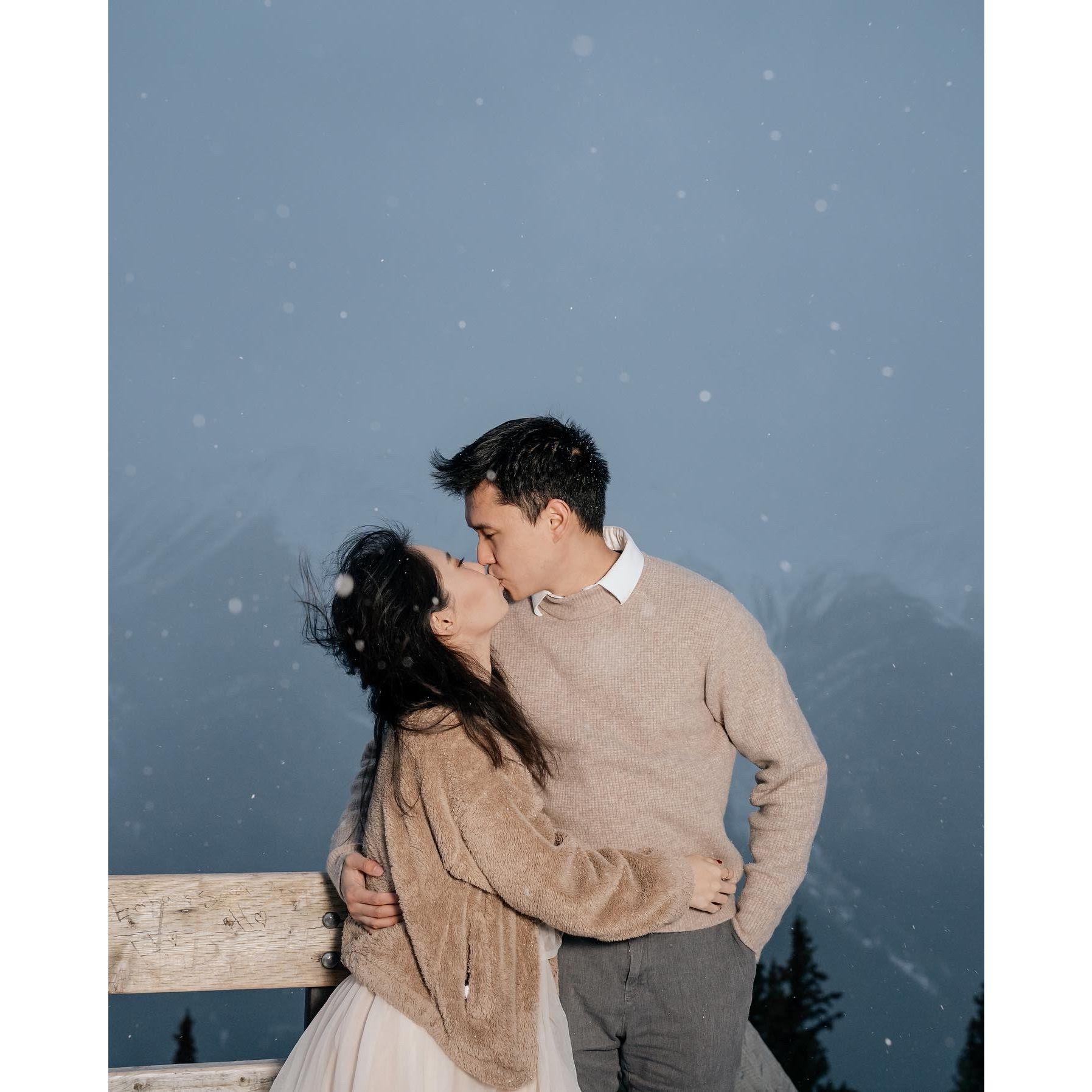 2022: Our engagement shoot on top of a snowy Banff mountain - it was freezing