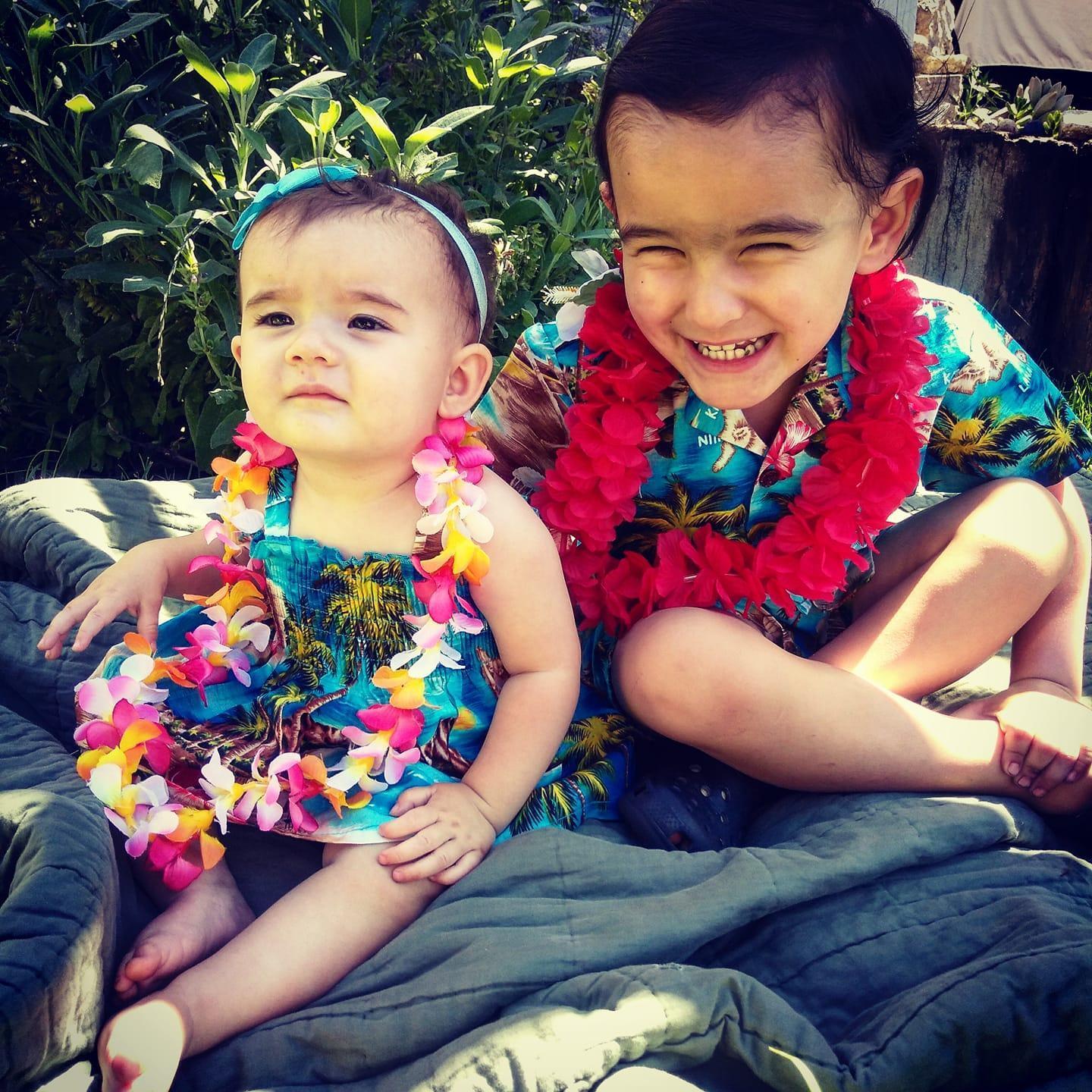 Our adorable babies sporting their matching Hawaiian outfits after Daddy's trip for Matt's wedding.
