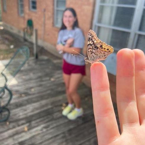This picture is of Reilly holding a butterfly... which Riley is scared of. She has a phobia of moths!