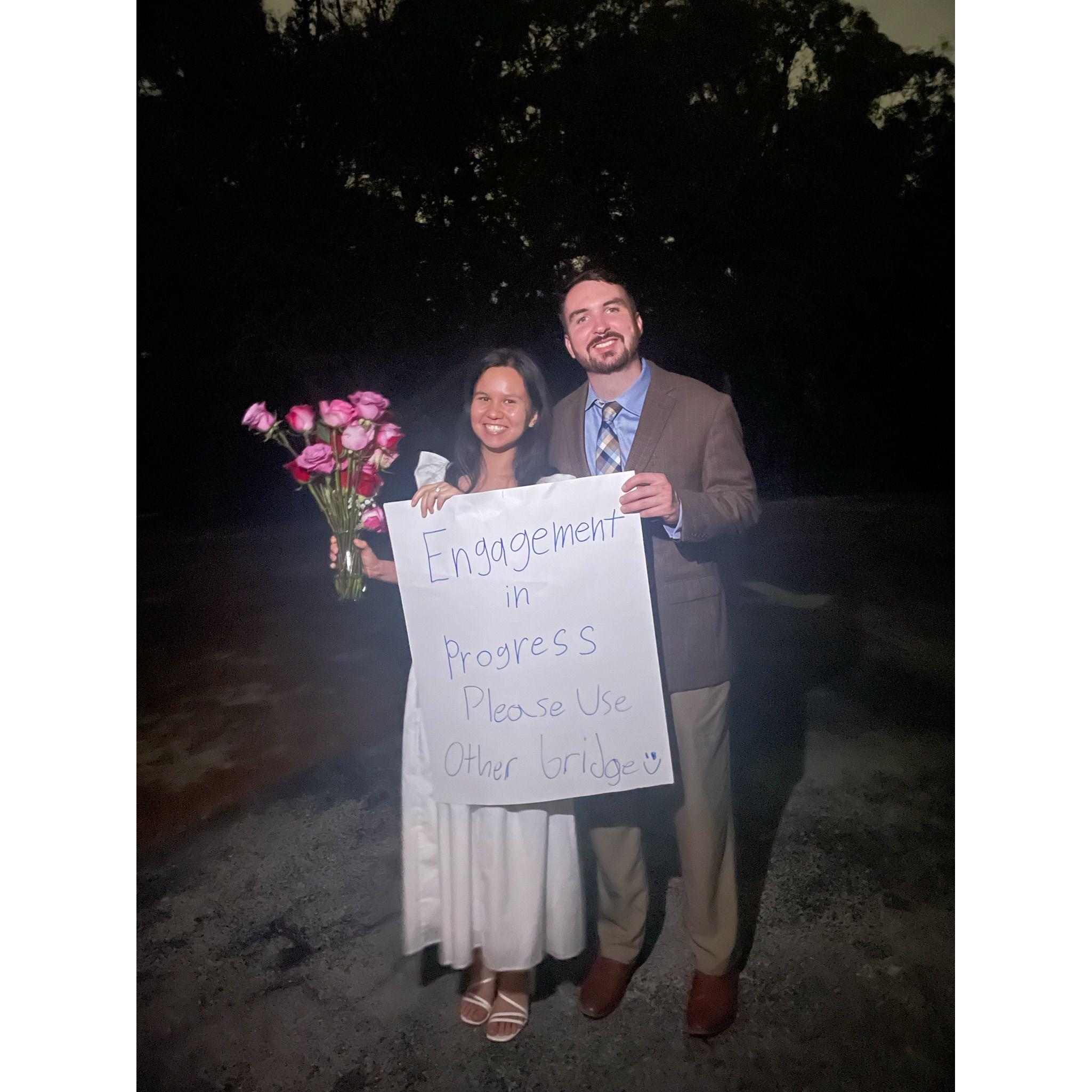 Kristy and Alex after the proposal. Kristy's friend, Alijah, made this poster to ward off people before the proposal.