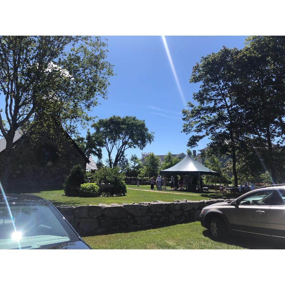The wider view shows the grass and gravel parking and walkways - stiletto shoes may not be the best choice, especially for lawn games during the "merriment"!