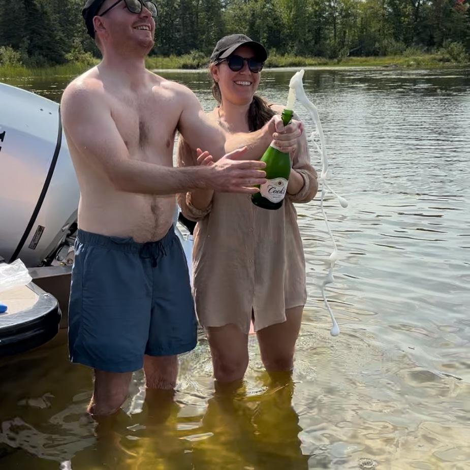 We closed on our first house together, while on vacation! Celebrating on the lake