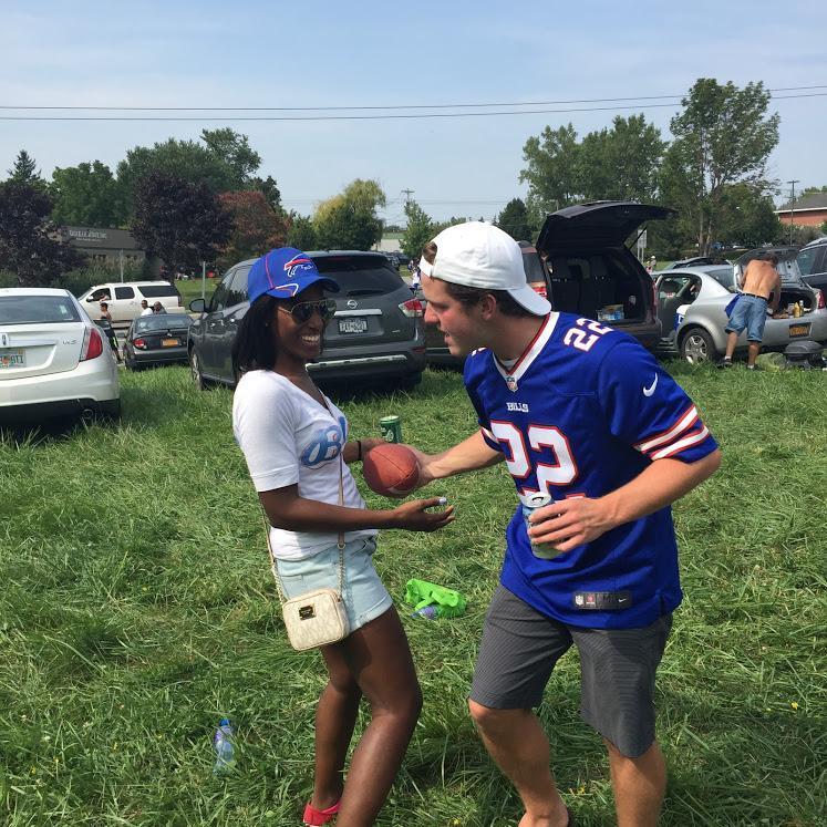 Bob had been trying to hang out with Lexi but a nasty sinus infection had her down for the count. This photo was taken after she recovered and they went to their first Bills game together!