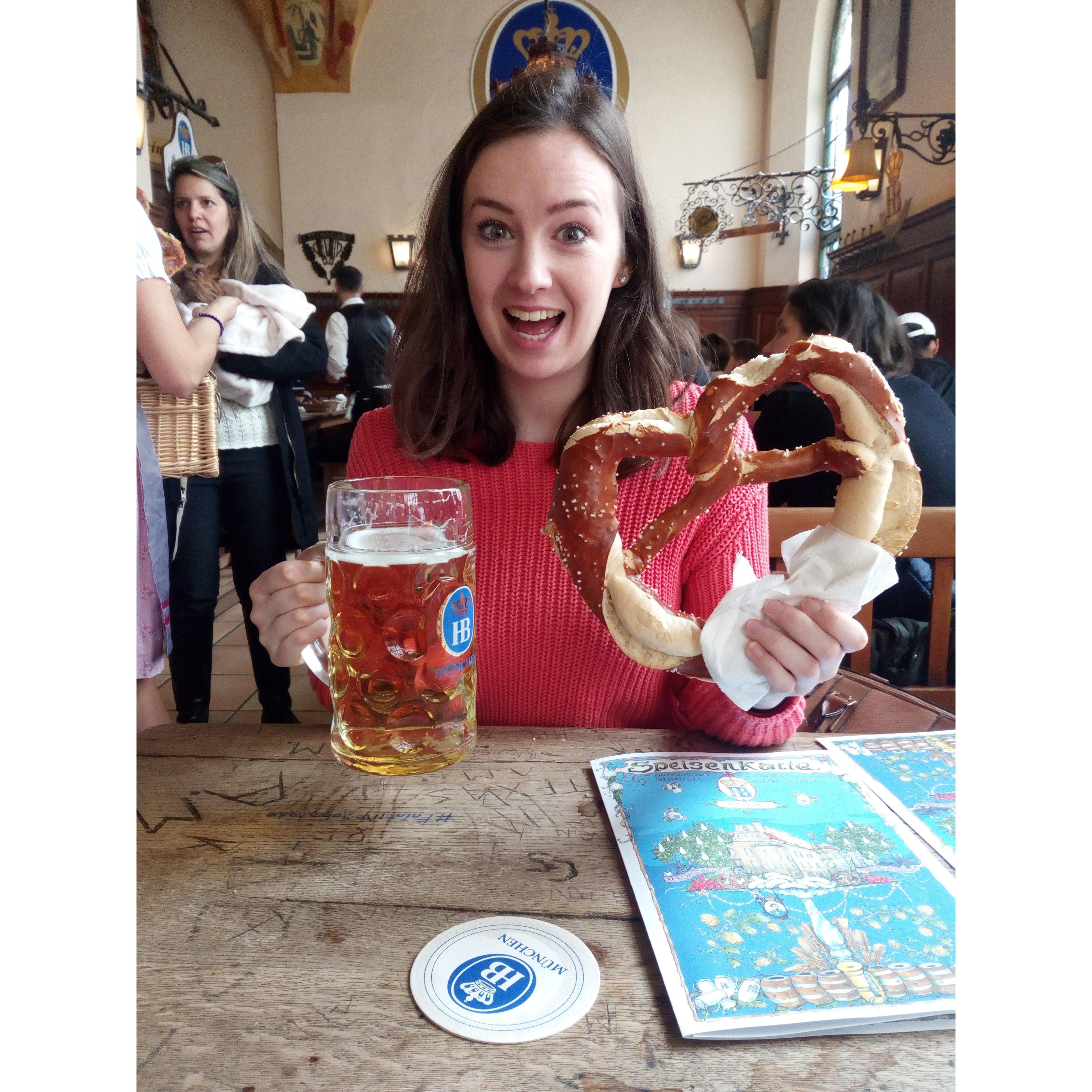 We loved our trip to Munich in 2018! There is so much going on in this photo, a litre of beer, a giant pretzel and a dog trying to eat a pretzel to the left of Lisa!