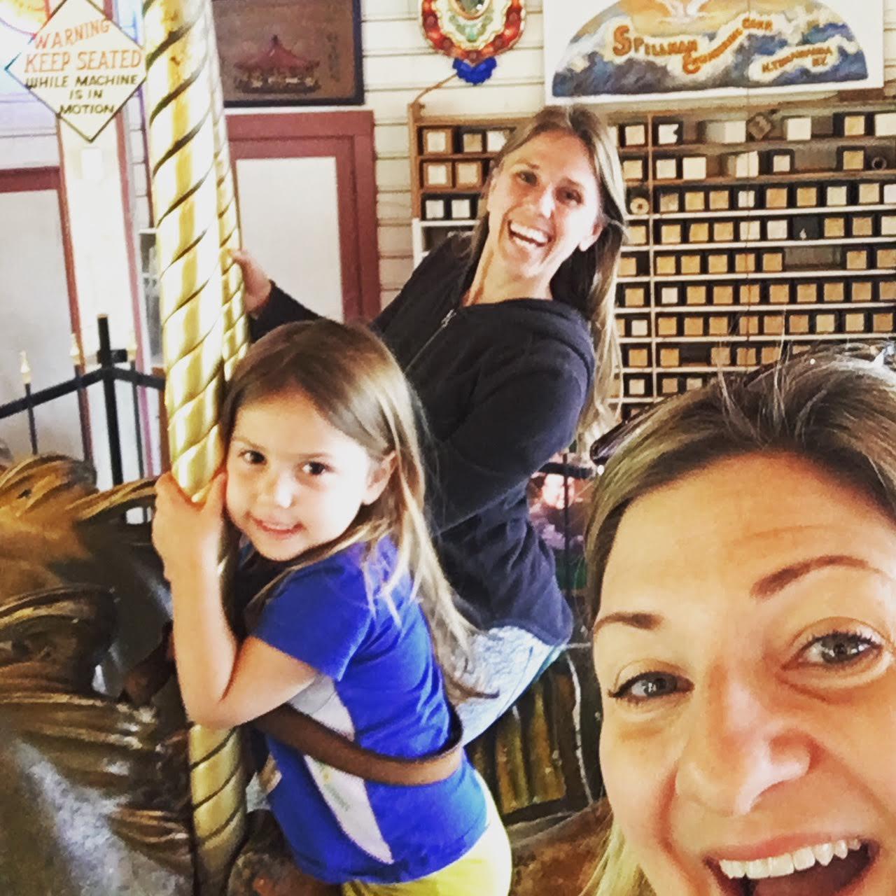 Erica (bridesmaid), Regina (flower girl), and me on the Griffith Park Carousel