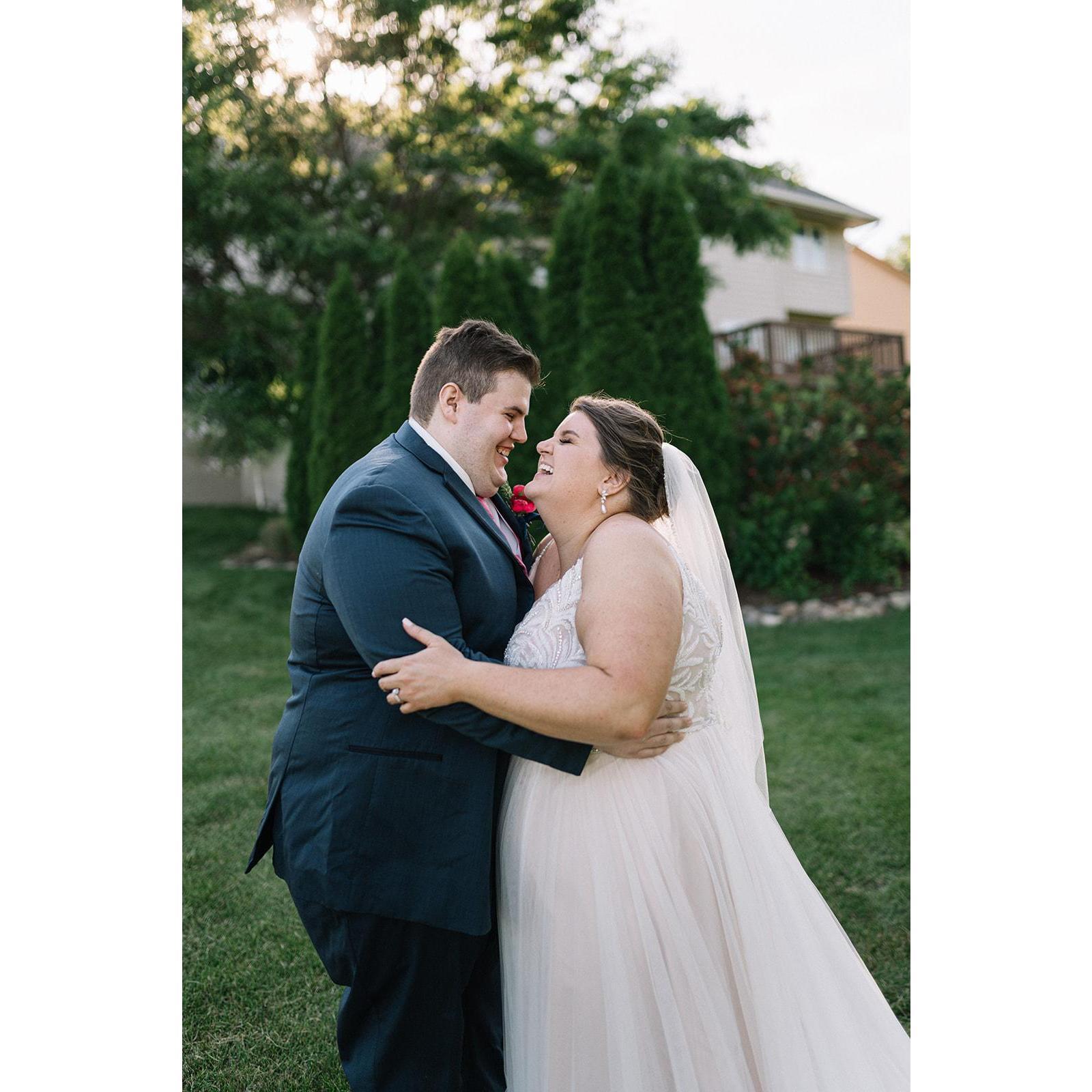 The Groom whispering sweet nothings to the Bride...or what he had for breakfast per the photographer's prompting!