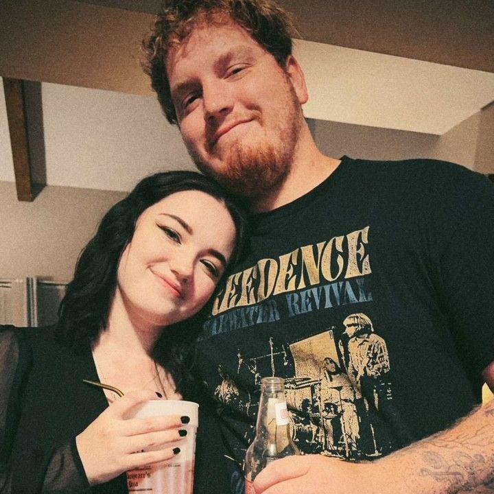 This was us at our house warming party after we moved into our first apartment together in 2024.