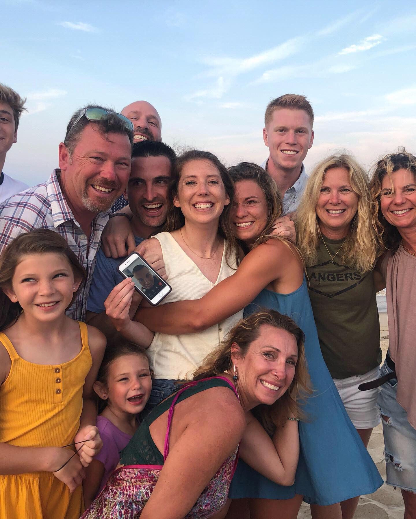 All smiles after getting engaged on the beach in Sandbridge, even Tyler was there thanks to Facetime!