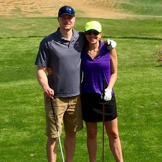 Dani showing Kyle how to swing a golf club at Eagle Mountain in Arizona.