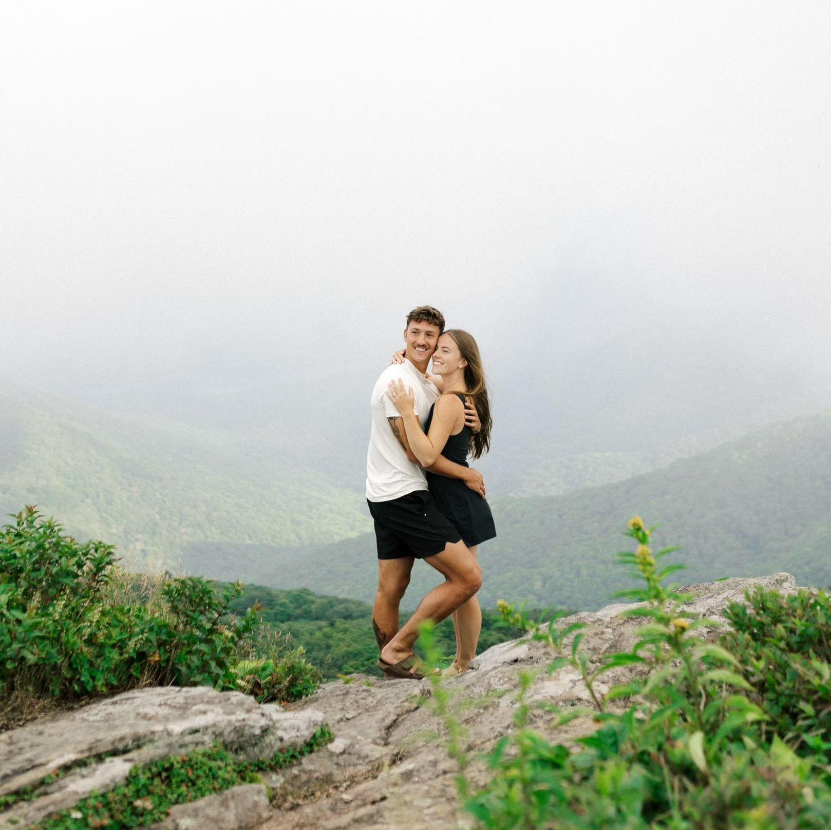 The proposal was absolutely perfect. We went on a hike and Jon proposed at the top in the clouds. He brought us a change of clothes and the clouds cleared up for us to celebrate and take photos! - Kat