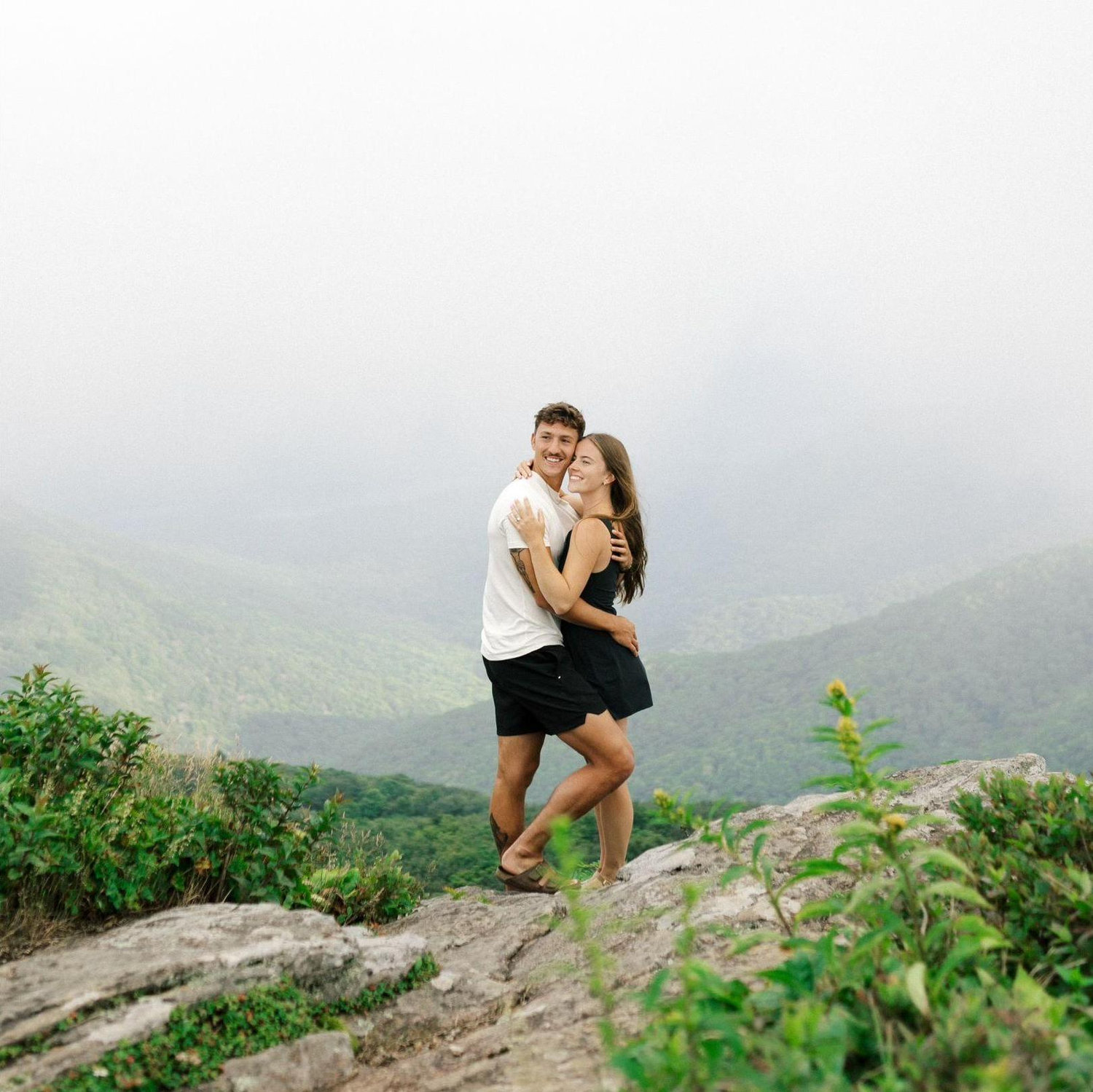 The proposal was absolutely perfect. We went on a hike and Jon proposed at the top in the clouds. He brought us a change of clothes and the clouds cleared up for us to celebrate and take photos! - Kat