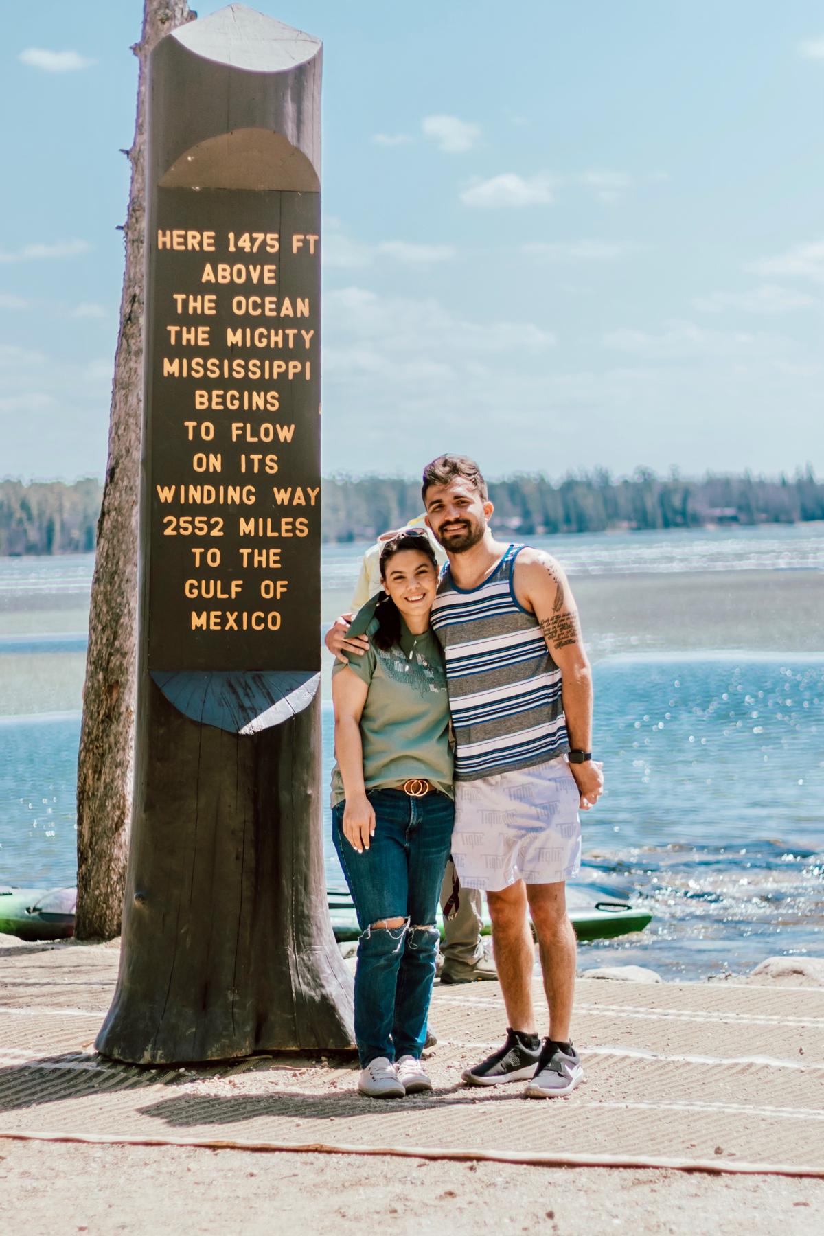 Stephanie and Ryan at Itasca State Park in May 2022. Stephanie is a huge geograhy nerd, so standing by this sign was a highlight for her!
