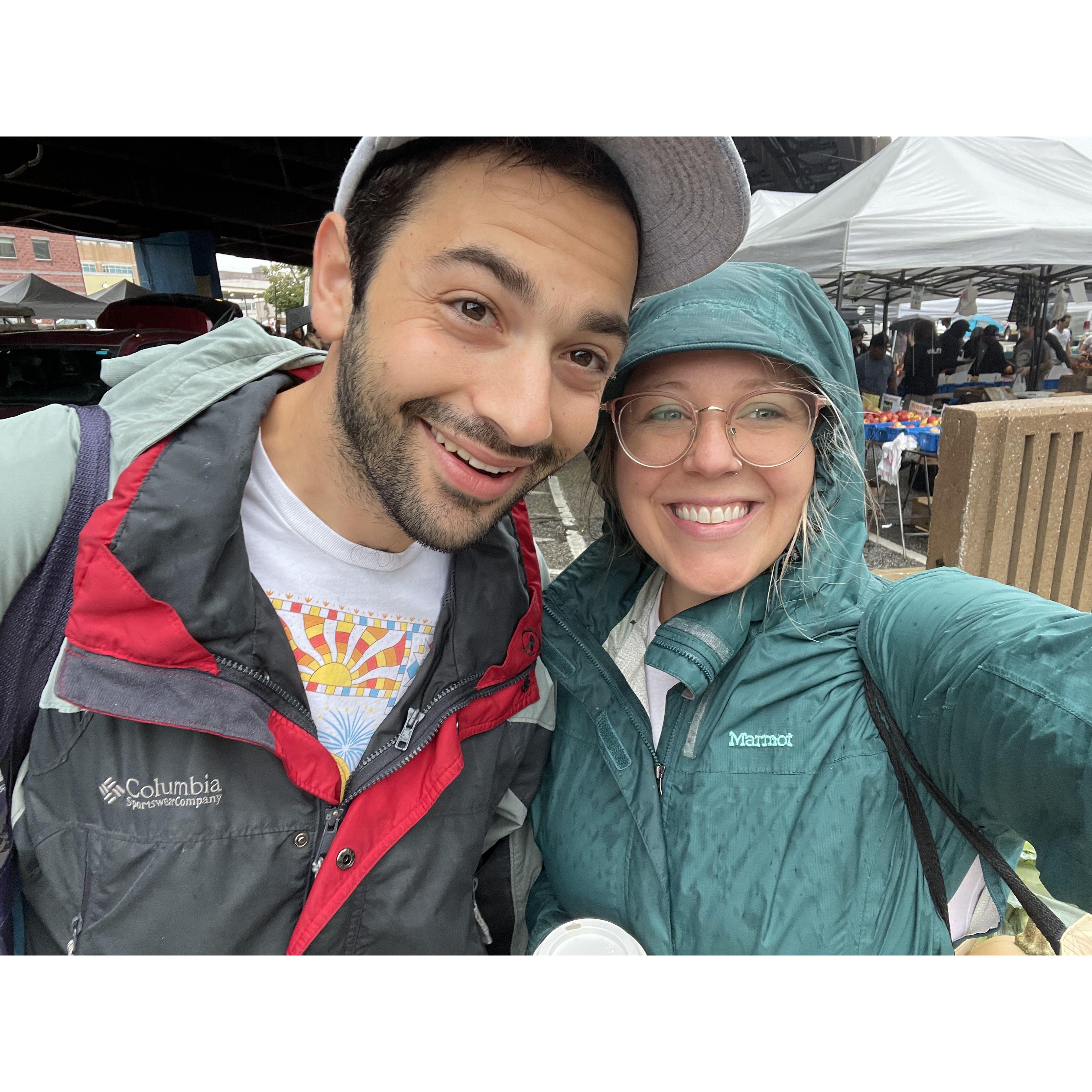 The rain will never stop them! Annie and Bobby visit the farmers market. September 2022.