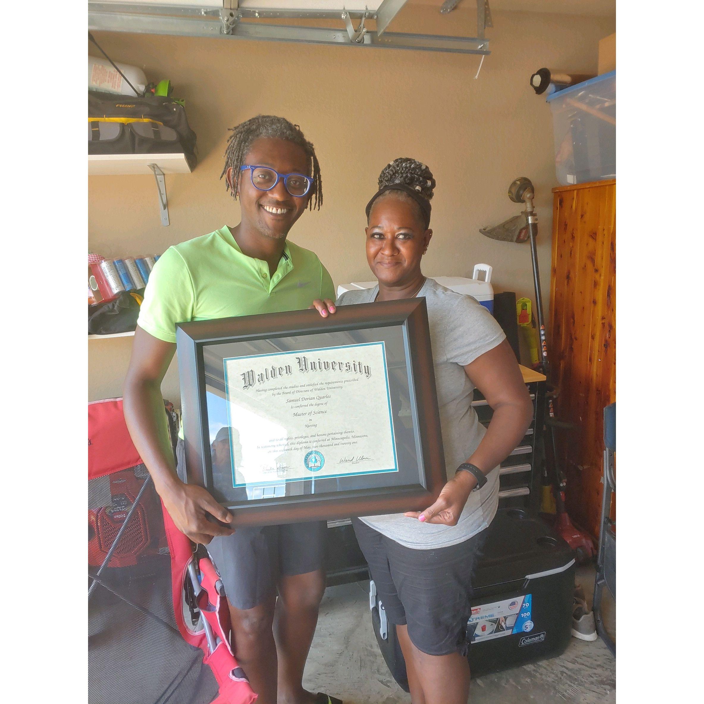 Me and my mom after I received my Master's degree in the garage of all places.