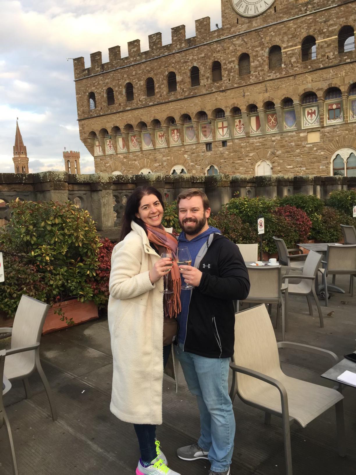 Drinking Prosecco on the rooftop of the Uffizi Gallery in Florence, Italy.