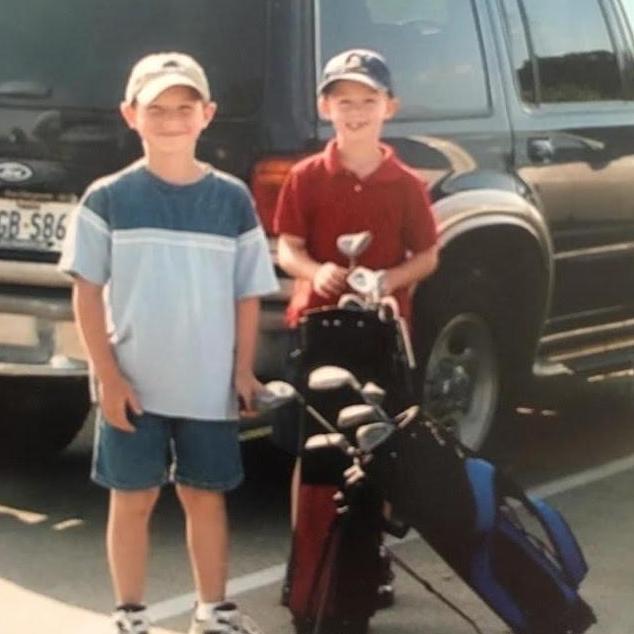 Zach and Adam playing golf! It was all down hill from here.