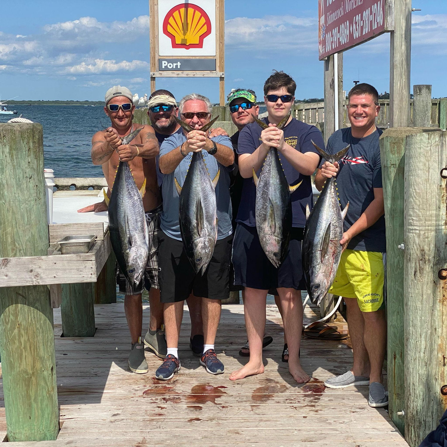 Tony, Stefanos & their fishing buddies on the dock at Oakland's