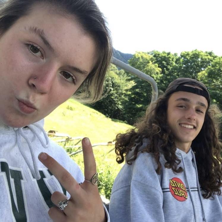 Resting on a chair lift at Sugarbush during a hike