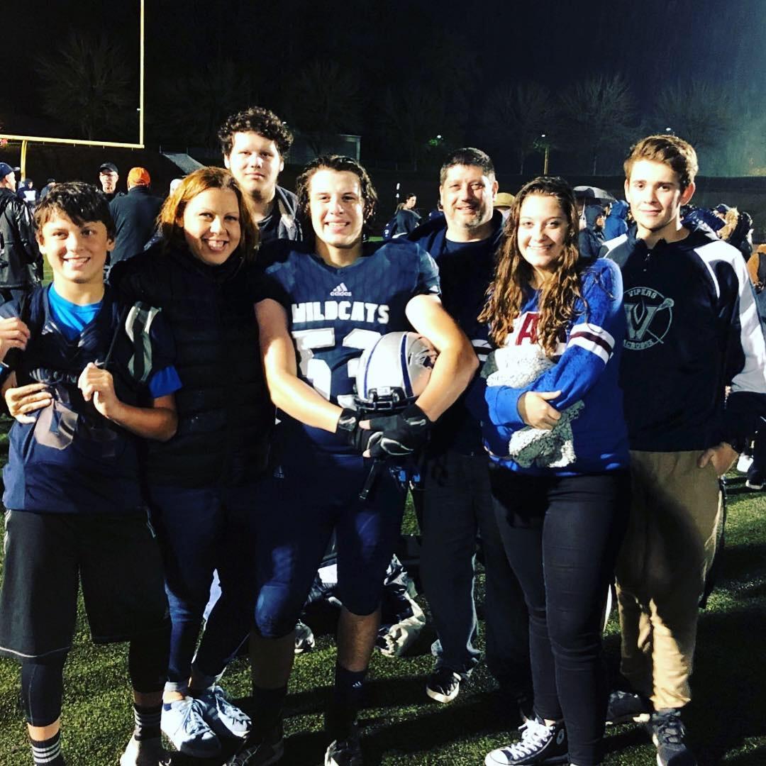 One of our first family photos, when we were starting to become a family! Of course, football is a huge part of our family!