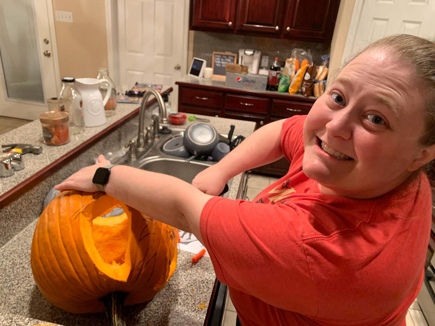 Our first Halloween pumpkin . . . Allie couldn't touch it until Ivy cleaned ALL of the guts out!