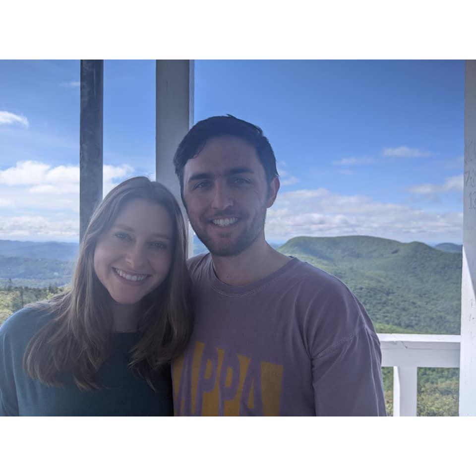 We love being outdoors together and hiking in the Blue Ridge Mountains. This was on top of a fire tower that we climb with the Tucker family (even though Alex doesn't like heights!)