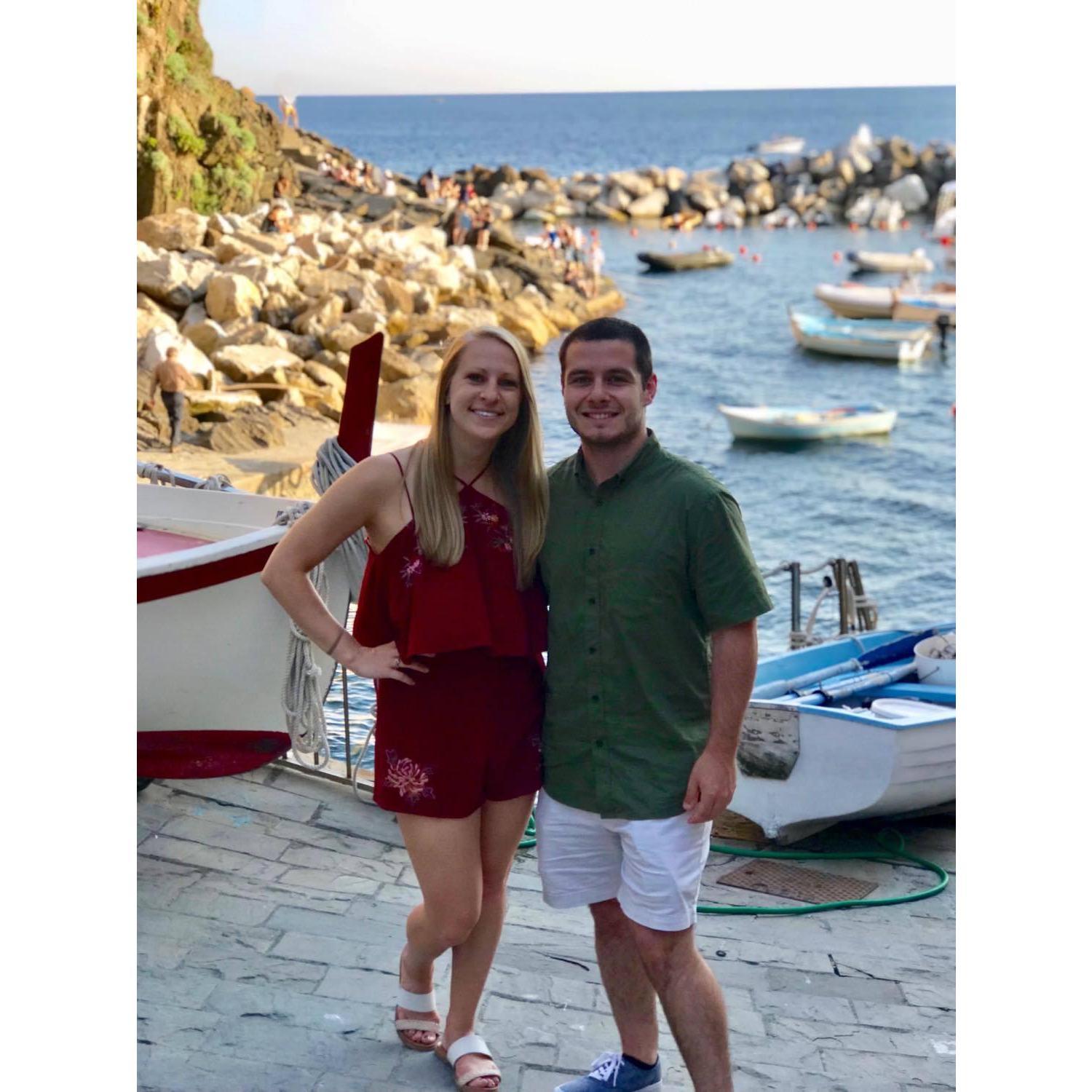Standing right it front of where we first kissed in Riomaggiore, Cinque Terre, Italy. We returned to Italy with Daniel's parents in 2018, 3 years after we met.