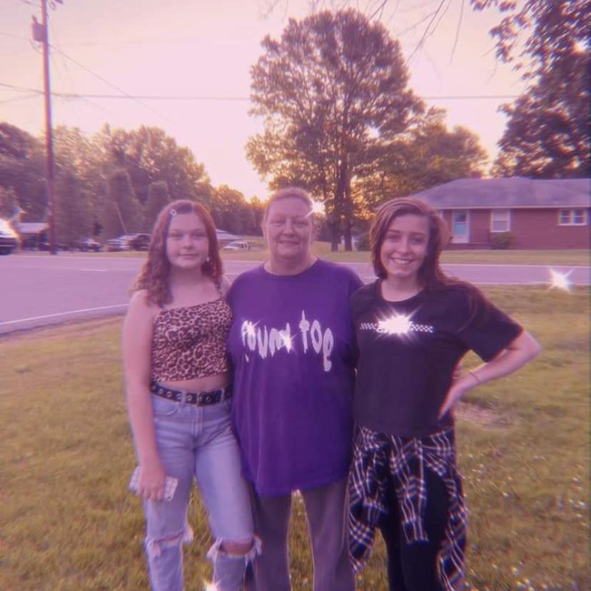 The maid of honor , mother of the bride, and the bride