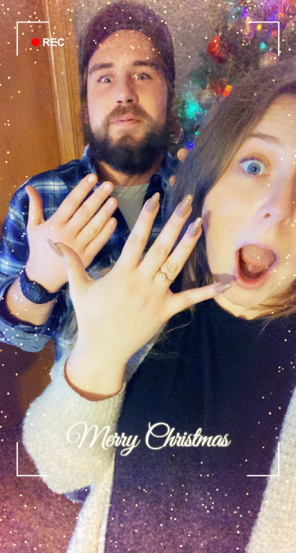 Showing off their initial excitement to be engaged... one of them looks a bit happier.
