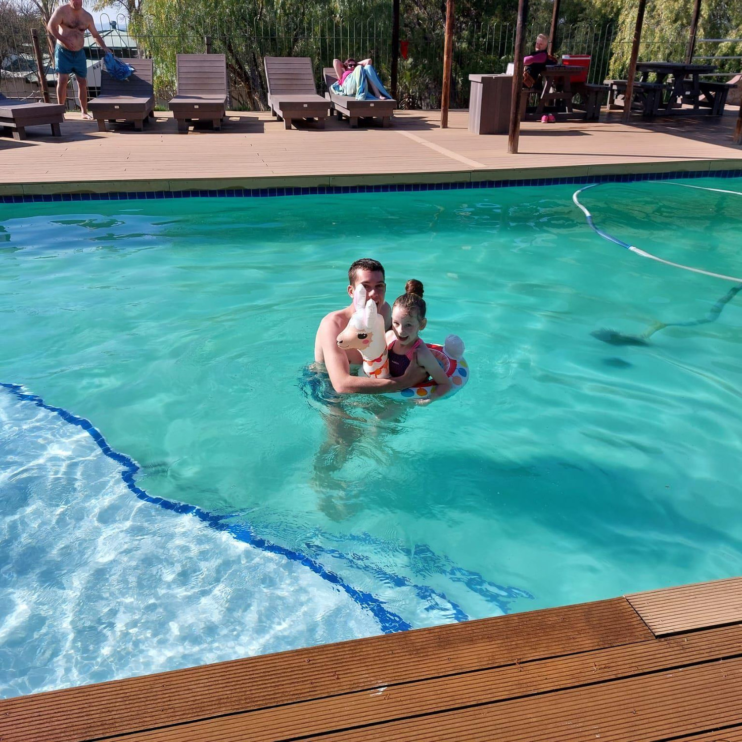 Playing in the icy cold water with Cousins.