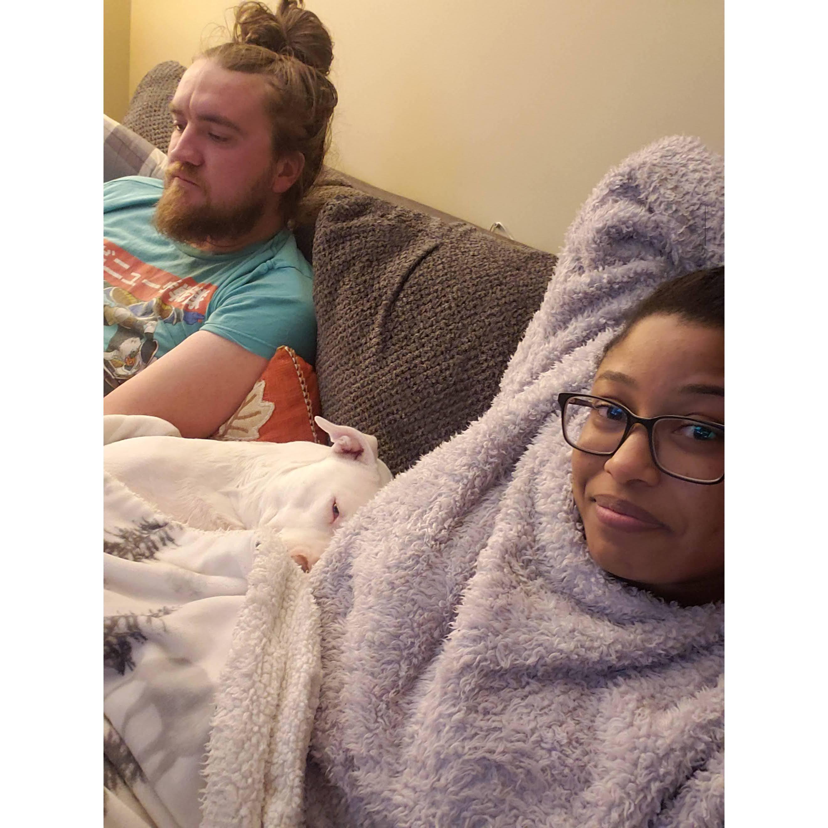 And her favorite: cuddles with us both. This photo is what every night looks like in our home. No matter how late it is or what we've been up to, we always end our day on the couch with family cuddles