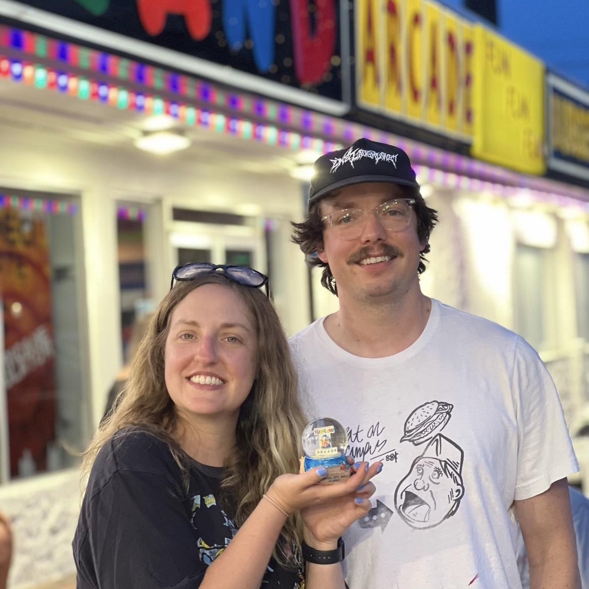 Panama City family beach trip 2023. We won a weird Funland clown mascot snow globe that is now proudly displayed in our living room!