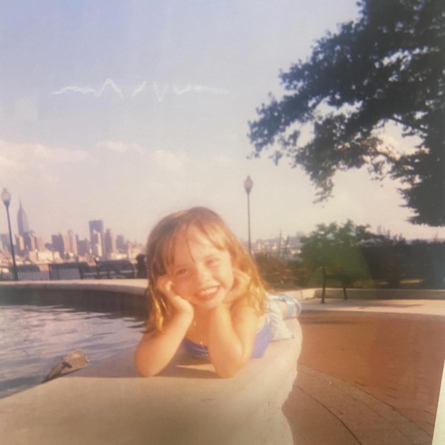 Izabella as a young girl living in her hometown (West New York, NJ ) 
She was a very silly and happy girl!