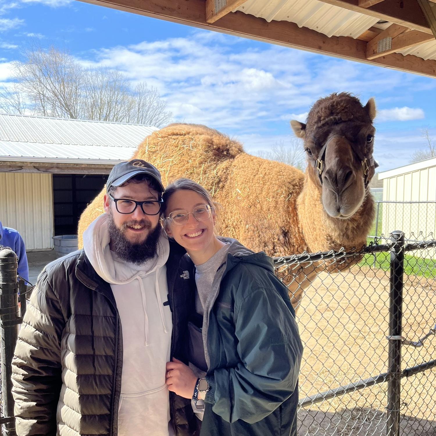 Smiling with a camel from Majestic Meadows petting zoo!