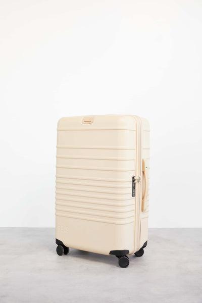 The 26" Check-In Roller IN BEIGE