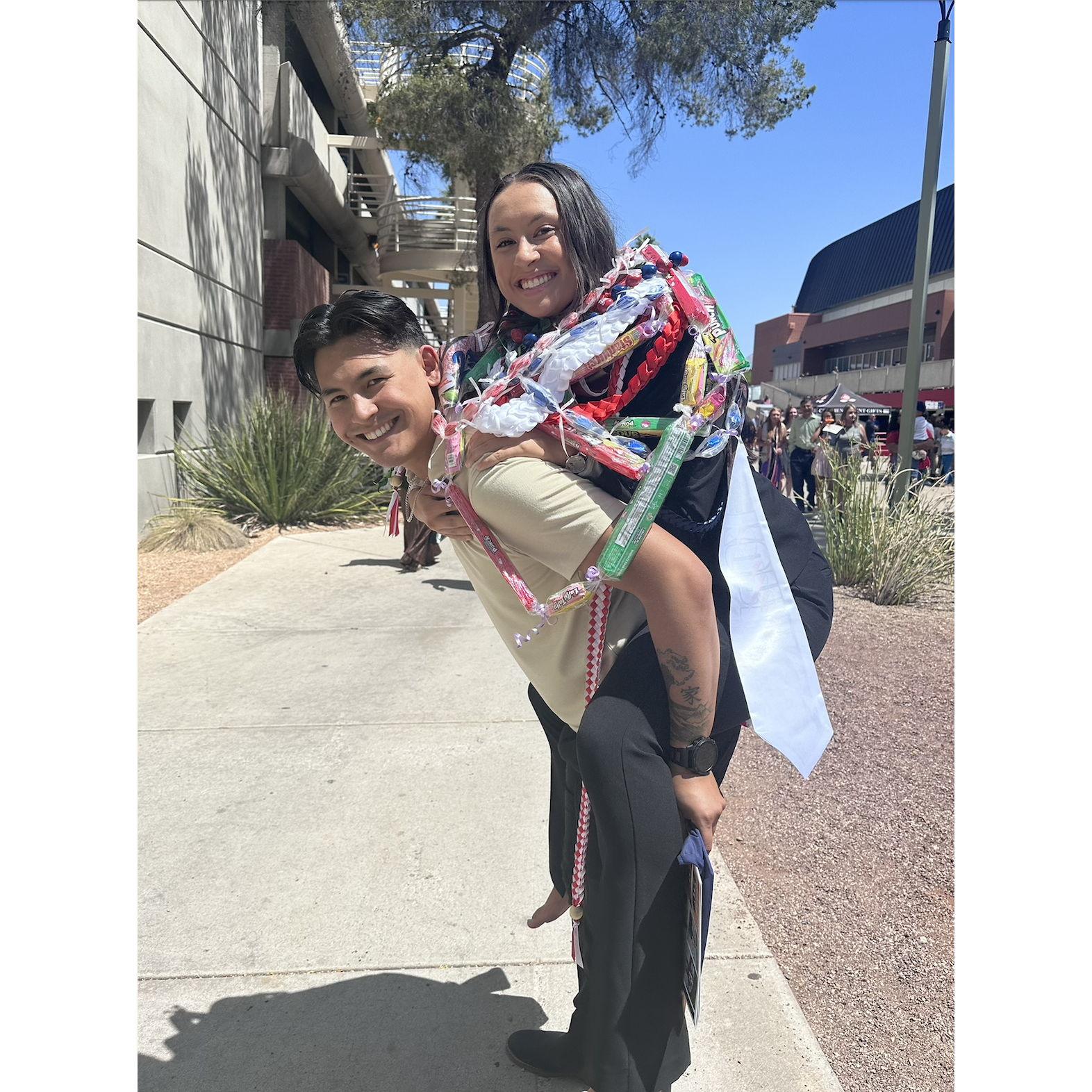 Eden's undergraduate college graduation. I walked barefoot outside because my feet were hurting, and instead of getting my feet all dirty, he happily offered to give me a piggy back ride.