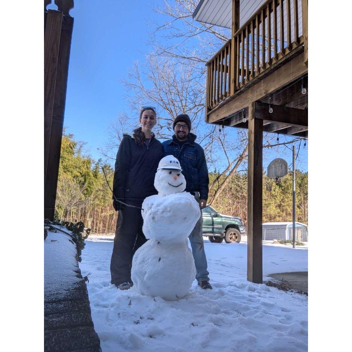First snow in Henderson, NC. Got the chance to build a snowman together. Construction top hat and all