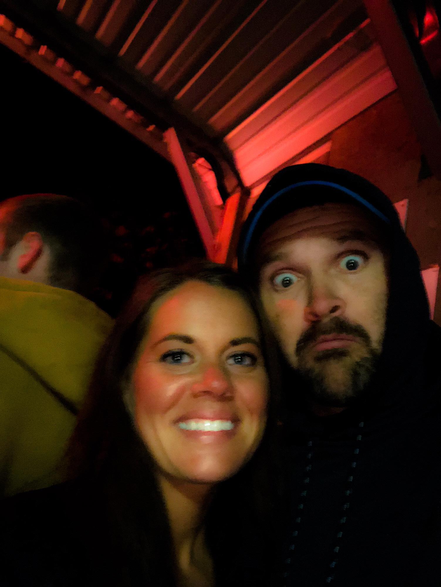 A quick selfie while we wait in line at a Haunted House with friends.