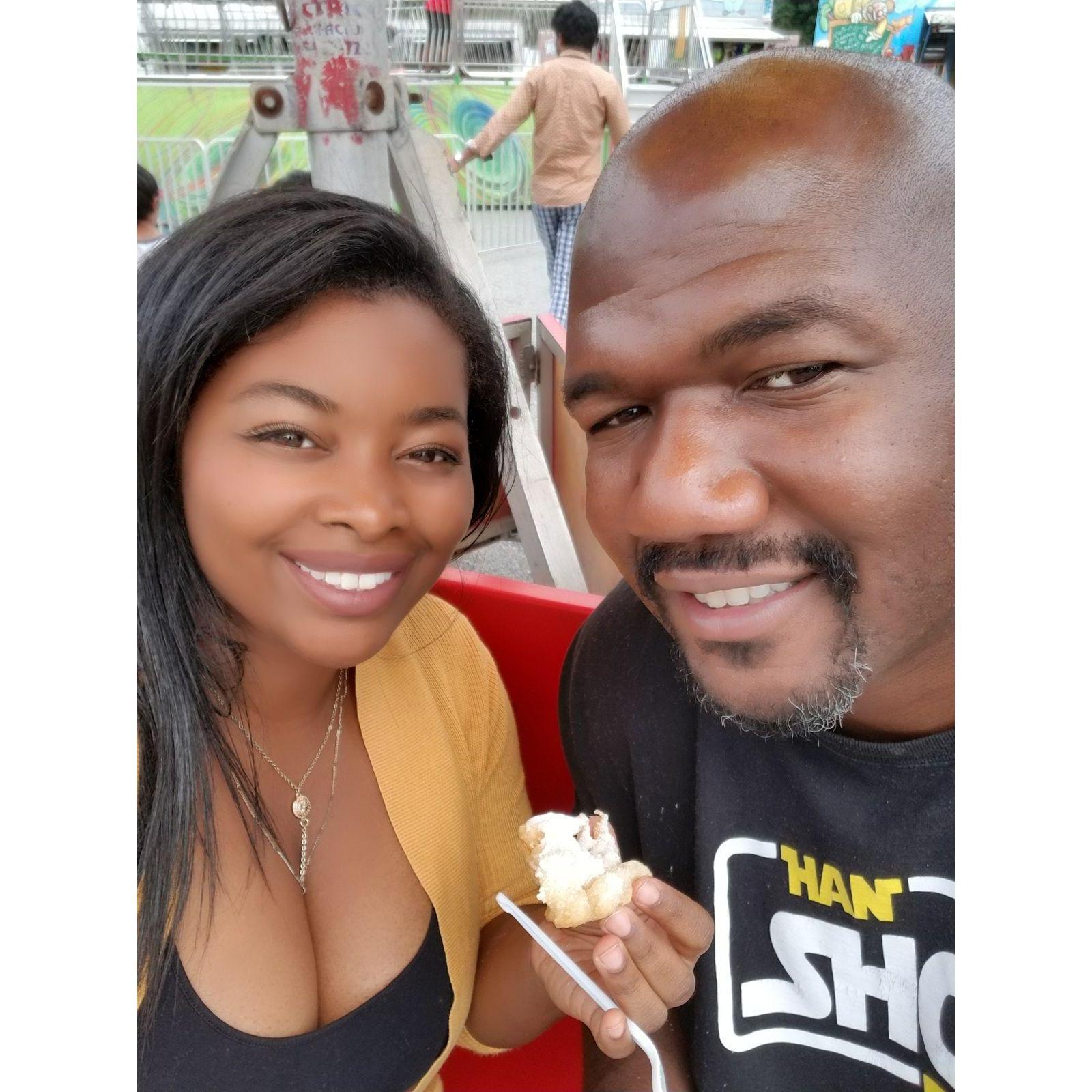 Eating funnel cake at the local carnival. I got really motion sick that day!!!! He was so understanding and nurse me to health!