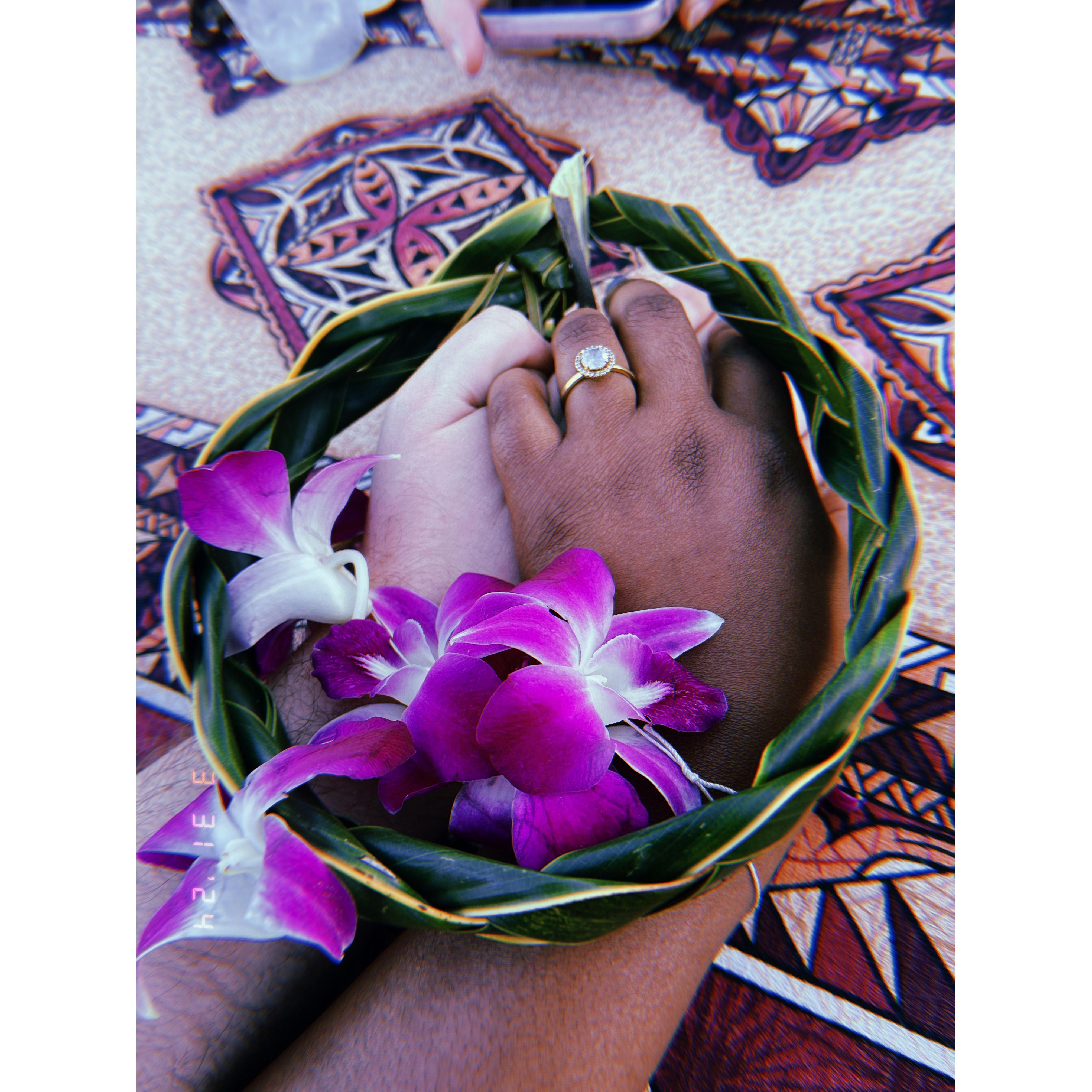 Us holding hands at a luau together and me making it very artsy and cute ❤️