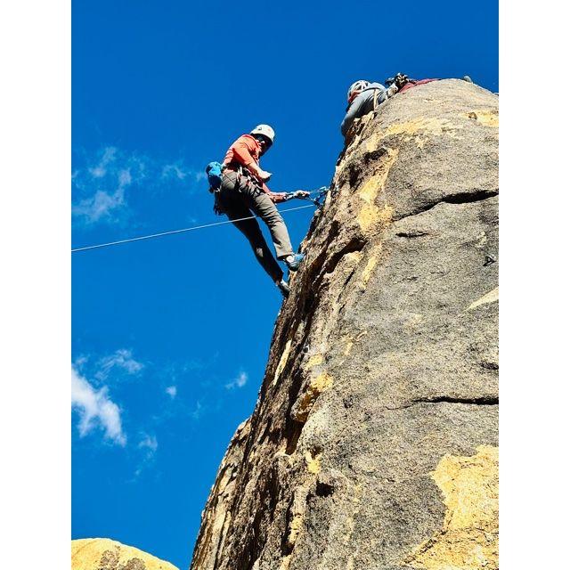 Alex on the mountain rock climbning.