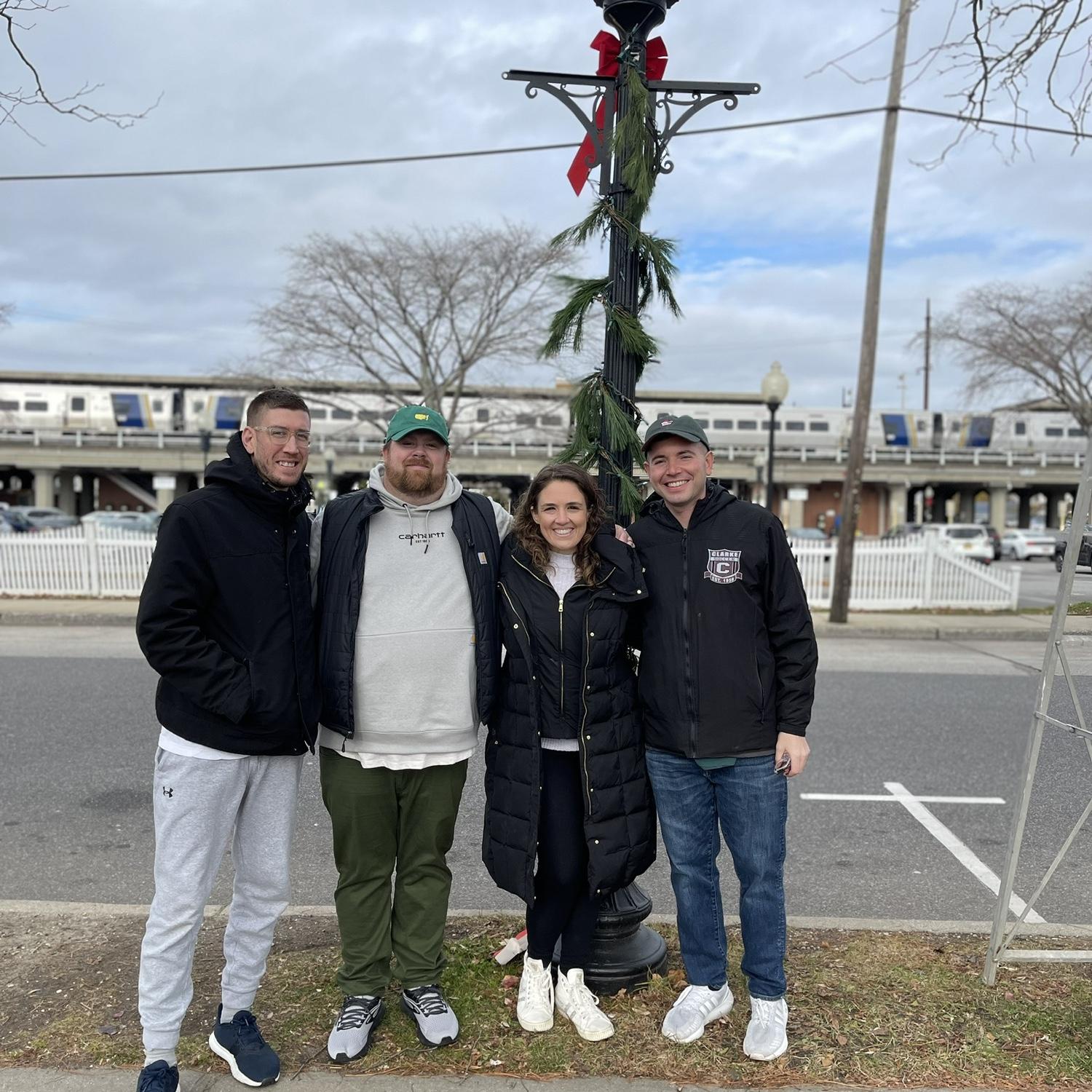 Christmas lamp post decorating. Babylon, New York