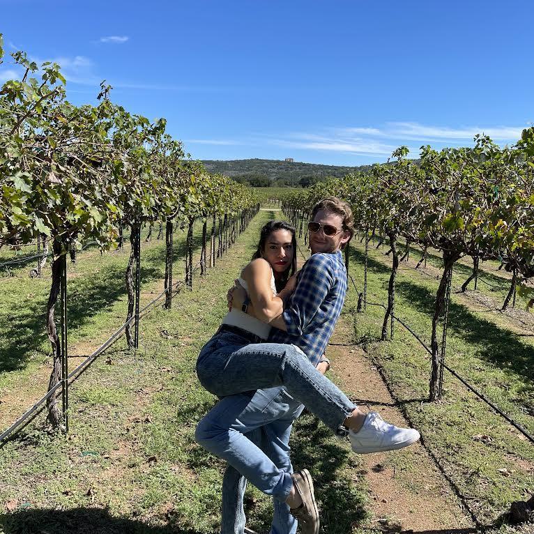 enjoying wine at a vineyard