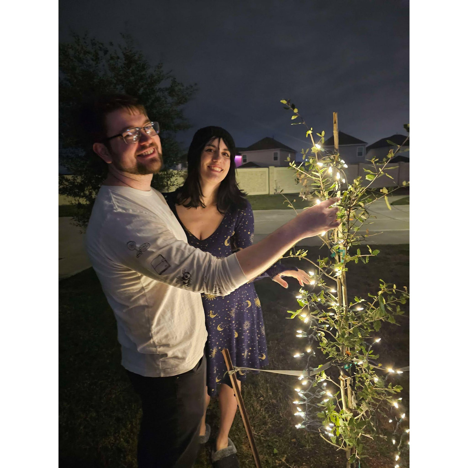 Our baby tree we planted together after the HOA threatened me.
