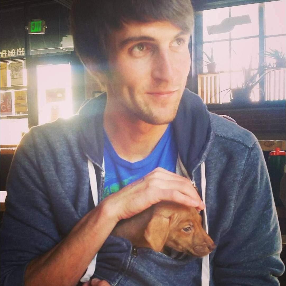 November 2017: "Puppies and Pints," an event Nick and Jen used to go to often before COVID. It also happens to be one of Jen's favorite pictures of Nick.