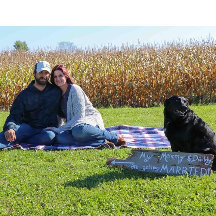 The morning after our engagement!! This is at my two day Women's Pampering Day on the Farm and Fall Family Festival. One of my vendors painted the sign which is a piece of wood from Uncle Bob's dock.