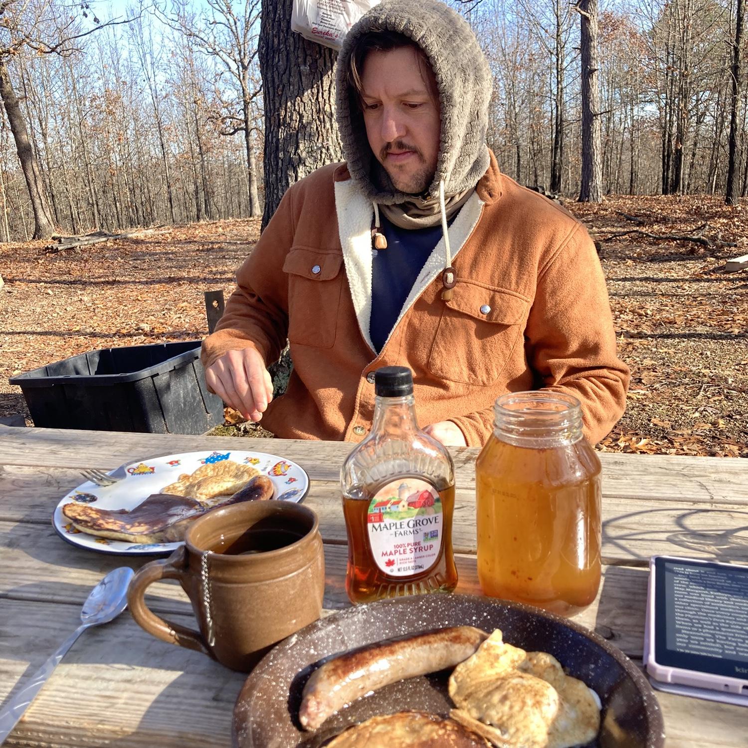 December! Nathan moved to Arkansas! One of many outdoor breakfasts enjoyed on the land. At this point we were cooking on a butane camp stove in the school bus and eating at our picnic table outside.