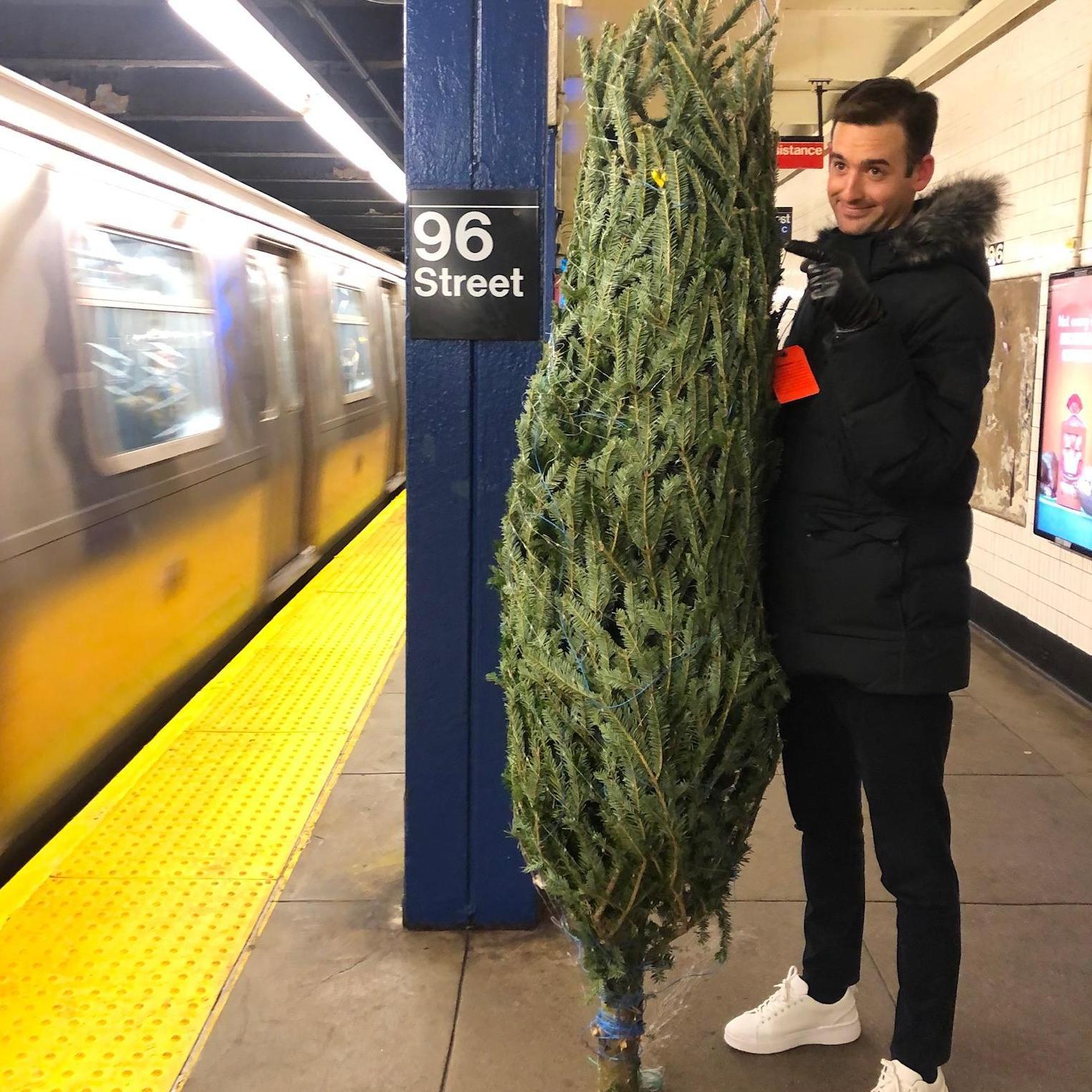 Is it even Christmas in NYC if your tree doesn't ride the subway?