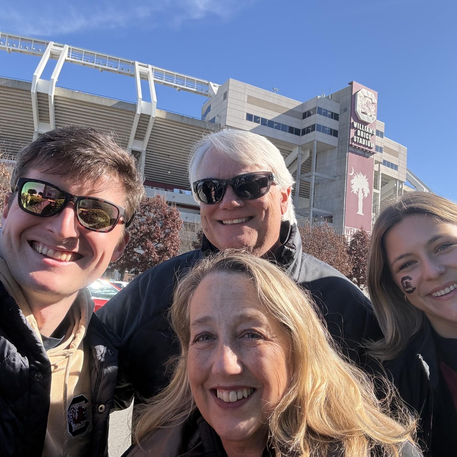 Cheering on the Gamecocks with our amazing officiant, Tayloe Harding, and his wife, Christine, in 2025!