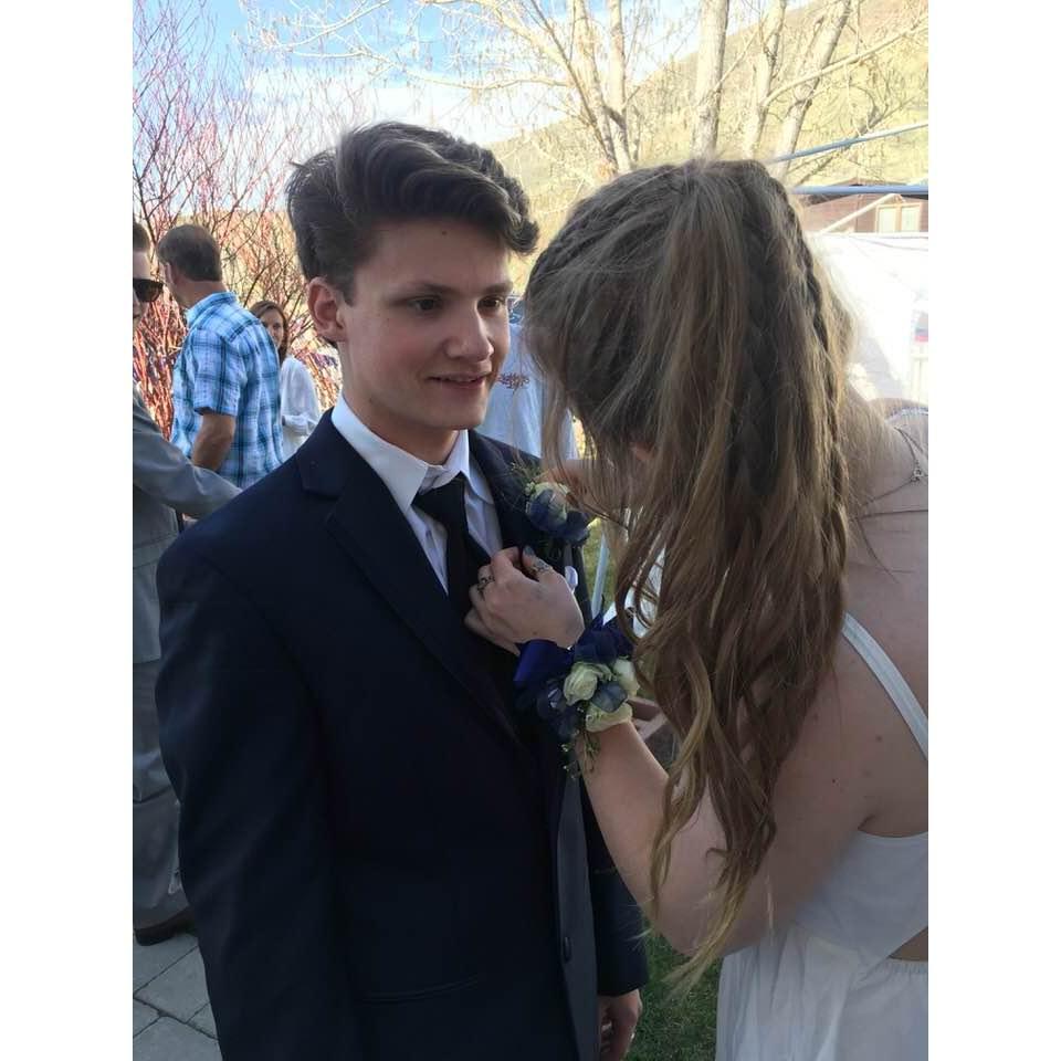 Pinning on his corsage at Senior Prom