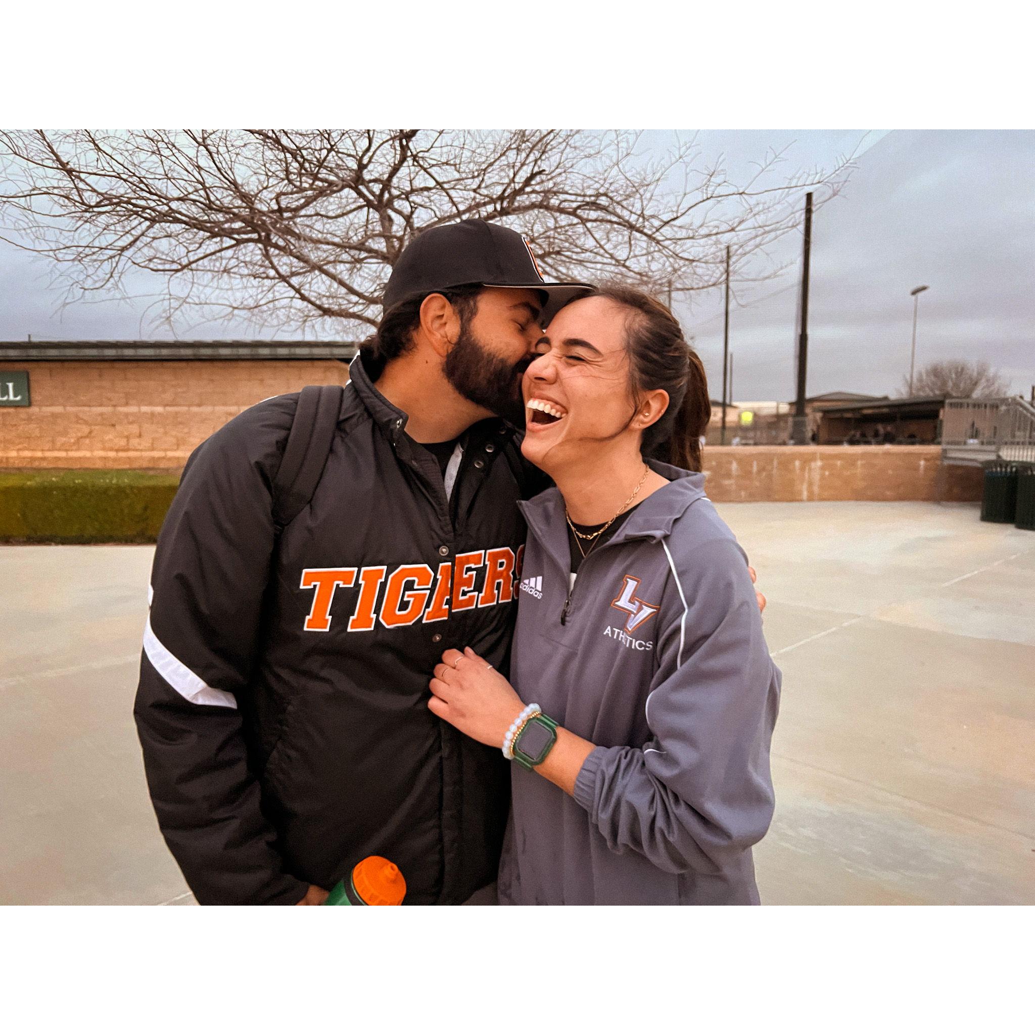 Remember how we said we bonded over working in college athletics? This is one of our favorite photos of us running into one another while both at work!